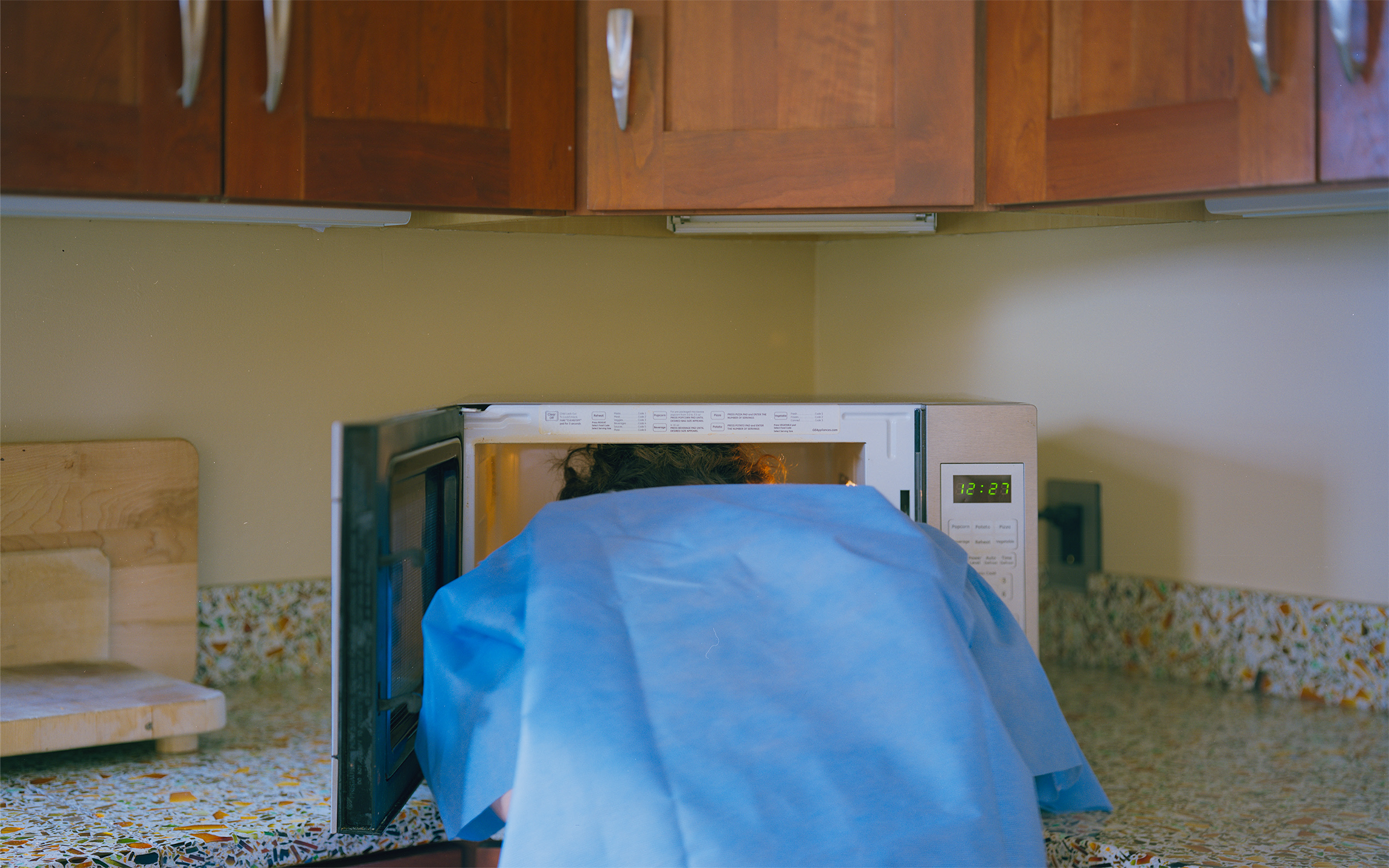 grey zine cover with black typewritten drugs and dosages on either side of a black line art of a juniper tree and the words 'THE JUNIPER TREE' in crimson red